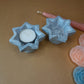 Steatite (or soapstone) hectogram candle holder