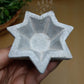 Steatite (or soapstone) hectogram candle holder